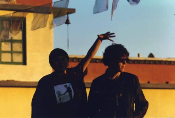 Choying holds her hand over Steve's head, up at Nagi Gompa